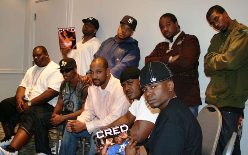 D-Block / The LOX with interviewer LD Williams and musician and producer Elijah LX Harvey, seated and standing in a hotel room, holding copies of CRED Magazine